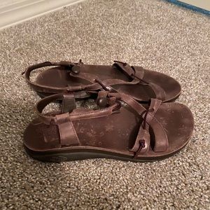 Brown leather Chaco sandals.